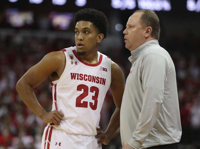 Wisconsin guard Chucky Hepburn speaking with head coach Greg Gard.